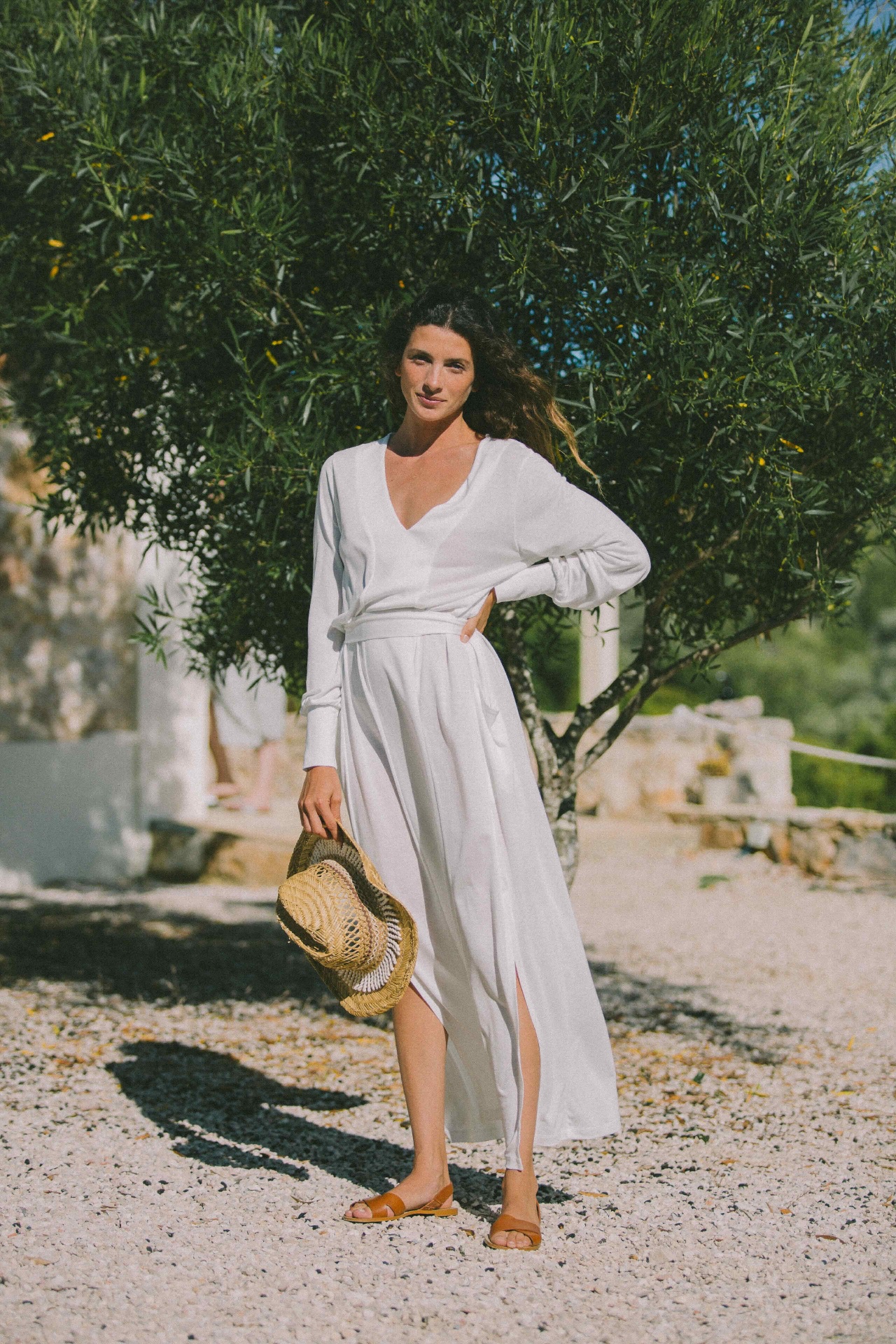 AWAN white wrap dress beneath olive trees