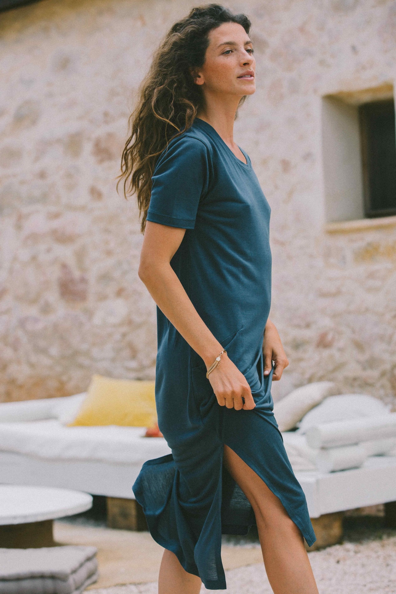 AWAN deep blue tee dress in a lounge setting