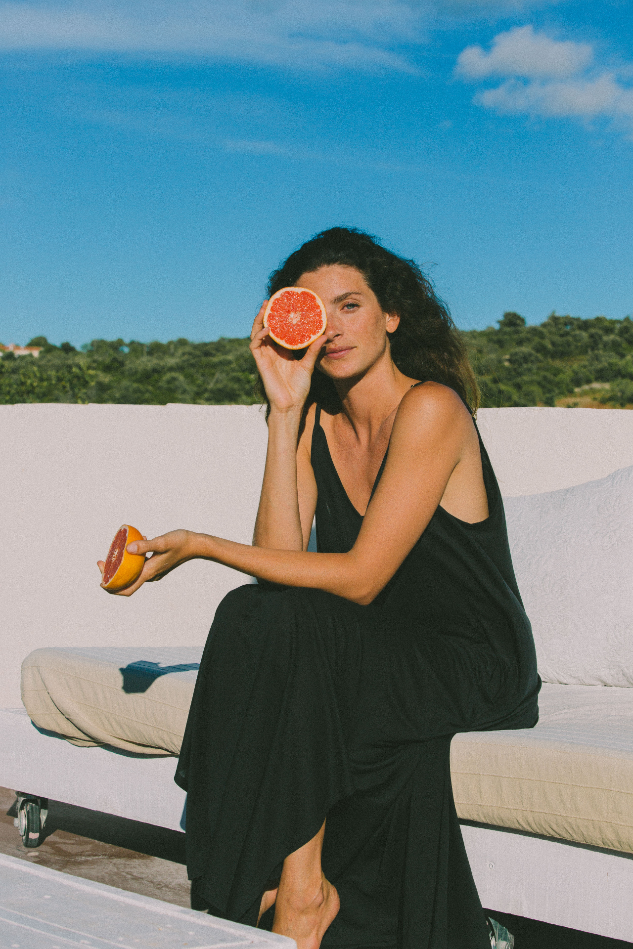 AWAN black slip dress, rooftop editorial