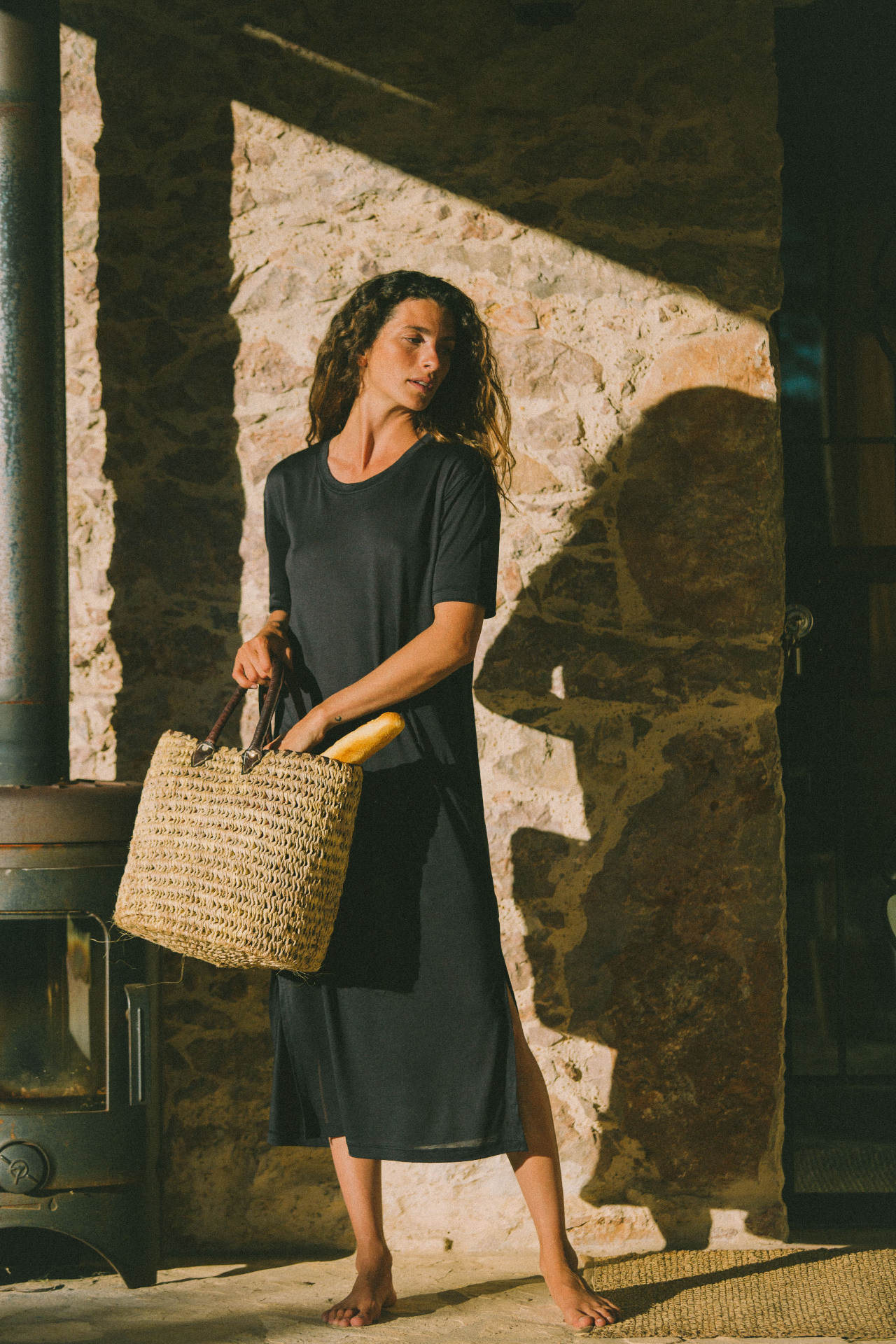 AWAN charcoal tee dress in stone doorway
